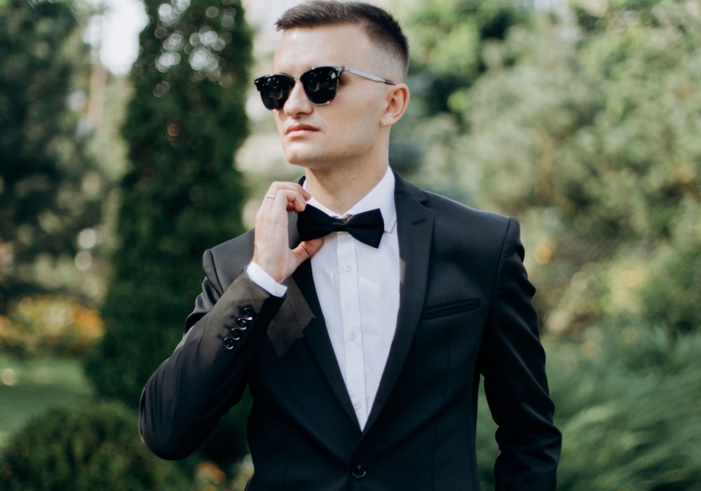 After Choosing SC: A sharp looking man dressed in tuxedo, standing pround and admired by all.