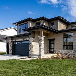 Angled view of a fashionable, modern, luxurious home in the Winfield community Latitude.