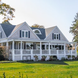 A bright sunlit white house in the Sierra Ridge community in Lowell